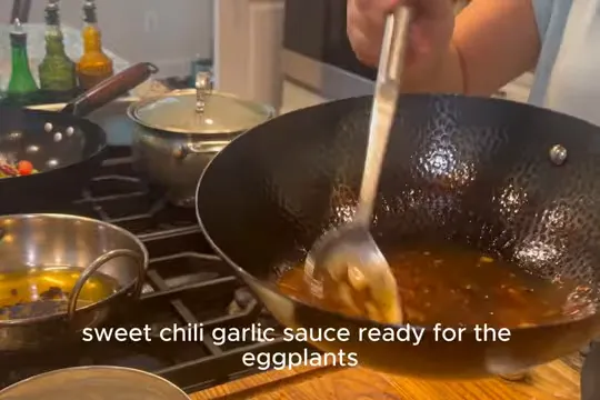 Glossy sweet chili garlic sauce in a black wok