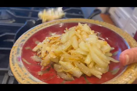 Plate holding glossy caramelized sliced onions