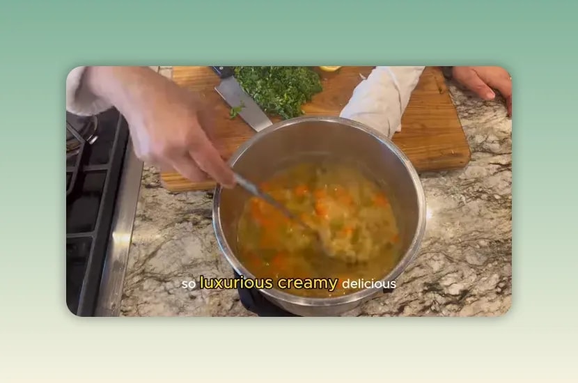 Creamy cooked pea soup with carrots and celery being stirred in an Instant Pot insert